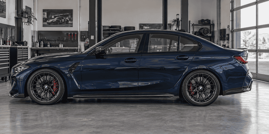 Side profile concept of a blue BMW G80 M3 with a carbon fiber side skirt extension