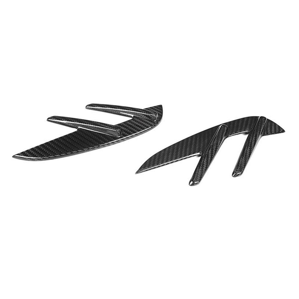 Angled view of two fender trim pieces.
