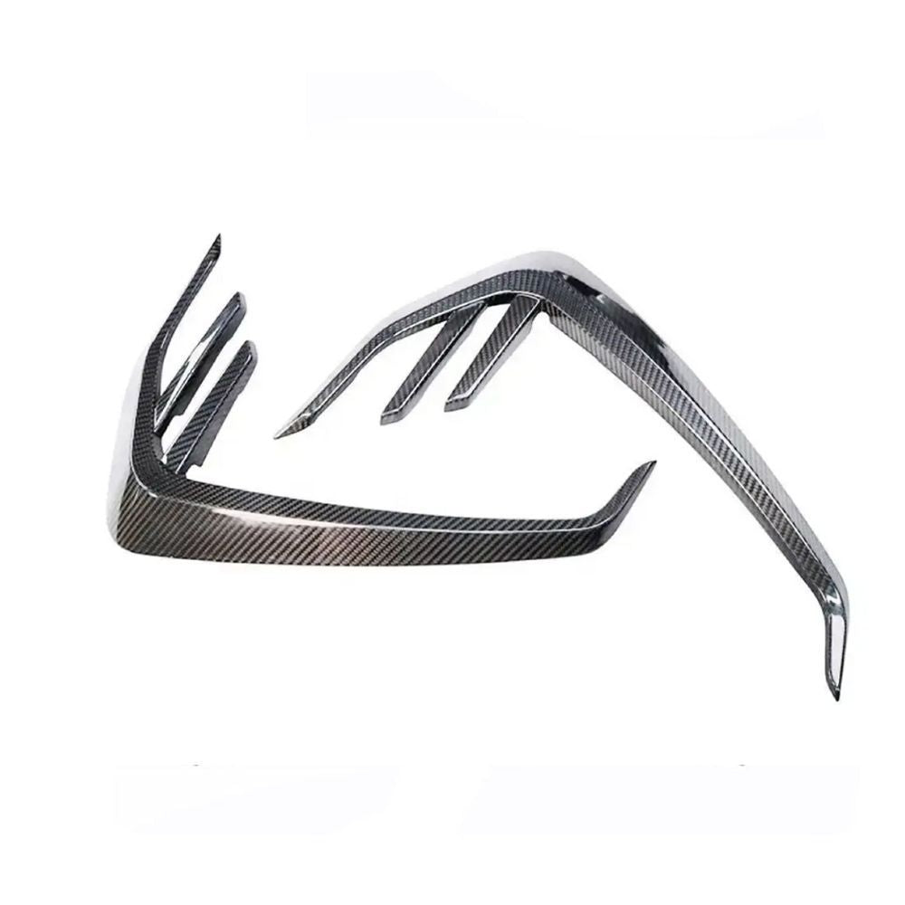 Angled view of two fender trim pieces.