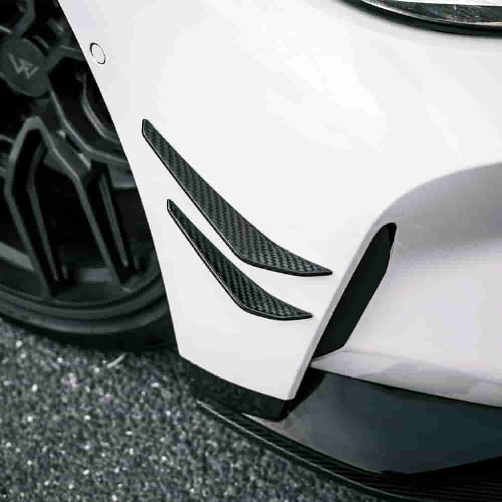 Bumper-corner detail showing patterned canard pieces.