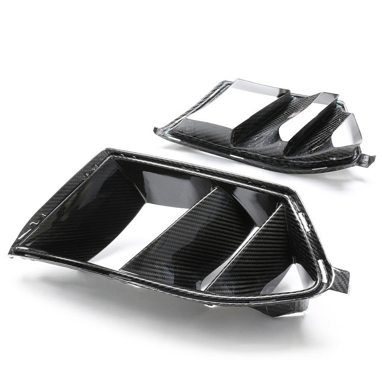 Two bumper vent inserts with angled internal dividers.