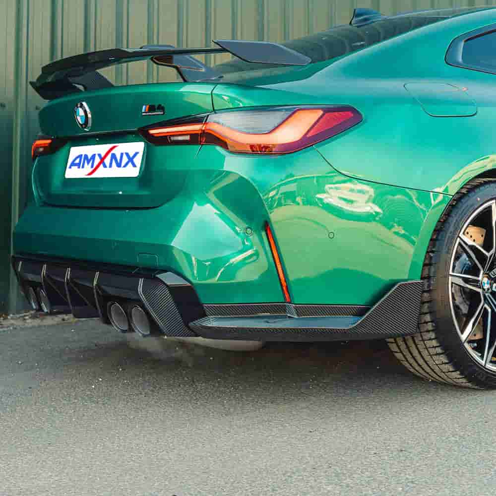 Opposite rear-quarter view of a green coupe.