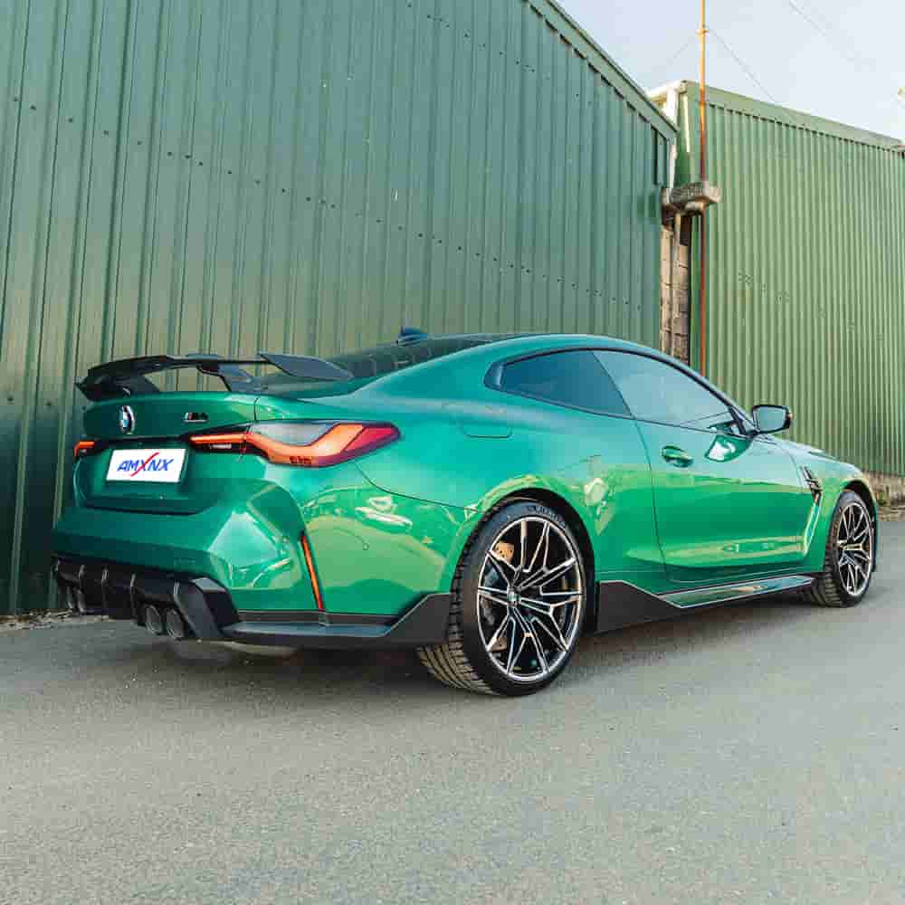 Full rear-quarter styling view of a green coupe.