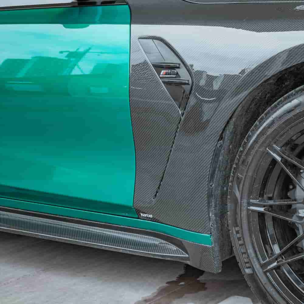 Side skirt end detail near a rear wheel.