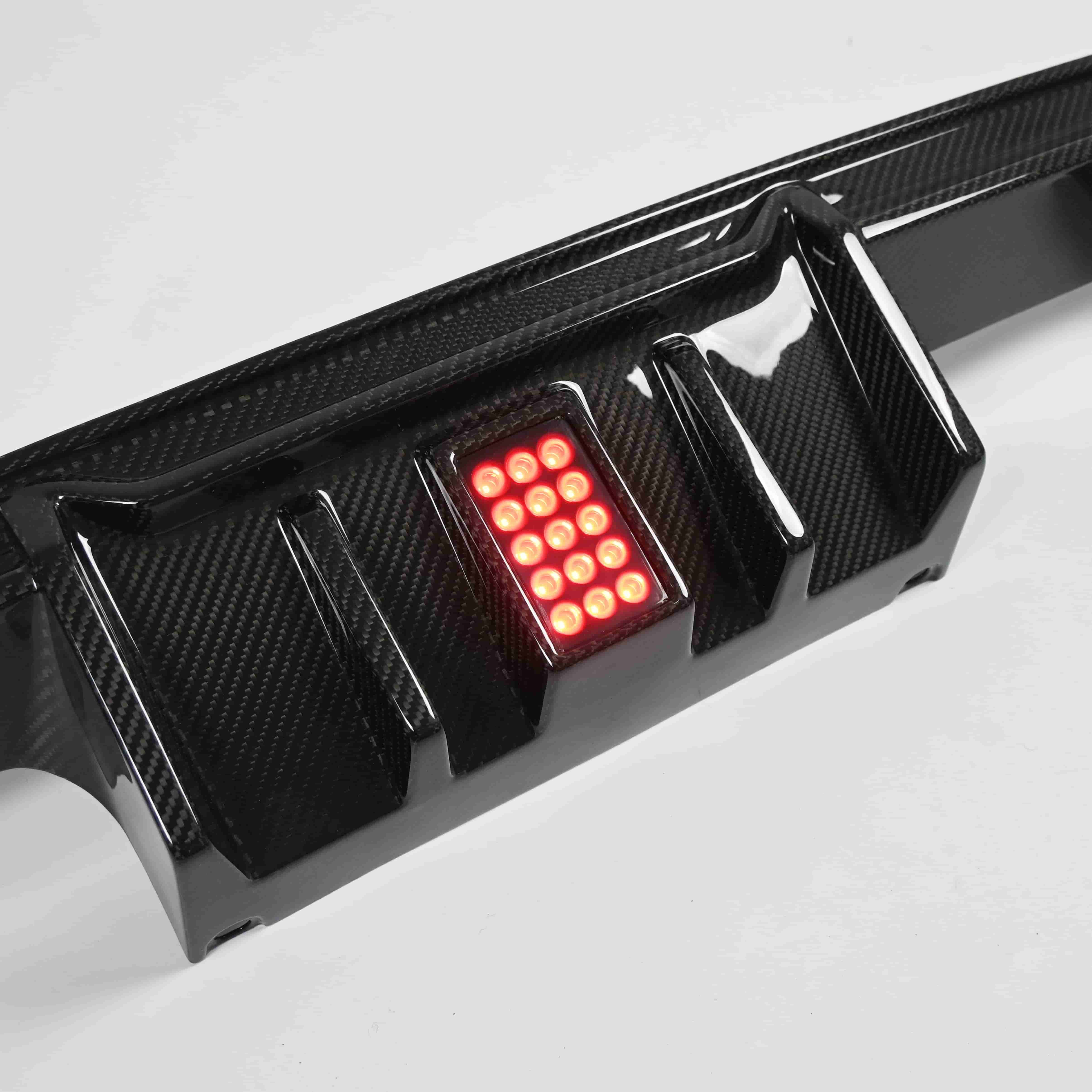 Close view of diffuser fins around a red center light.