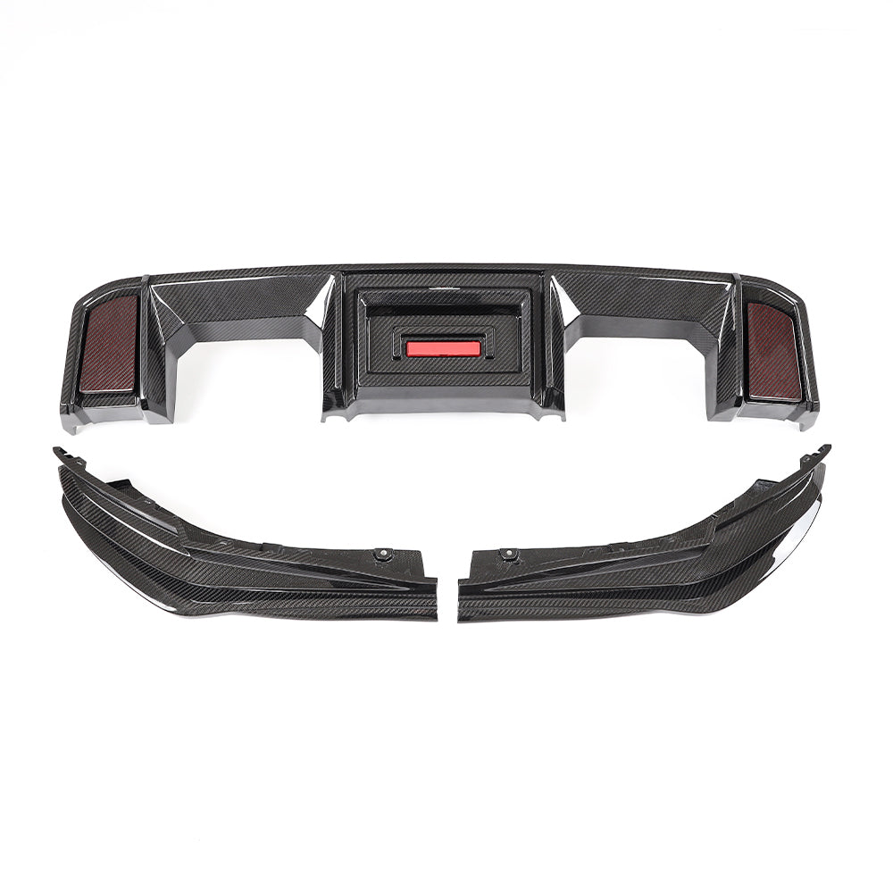 Rear diffuser center and separate lower pieces laid out together.