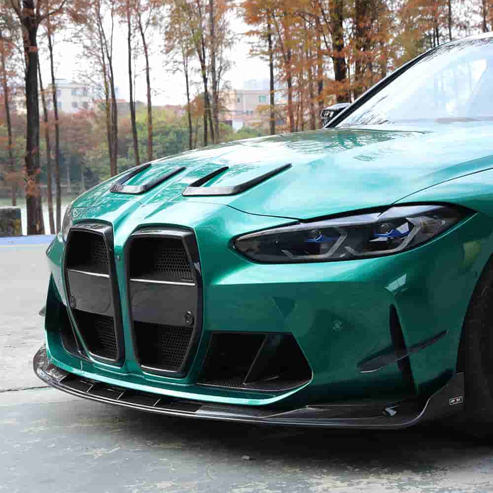 Front-quarter view of a green sedan with exterior styling parts.