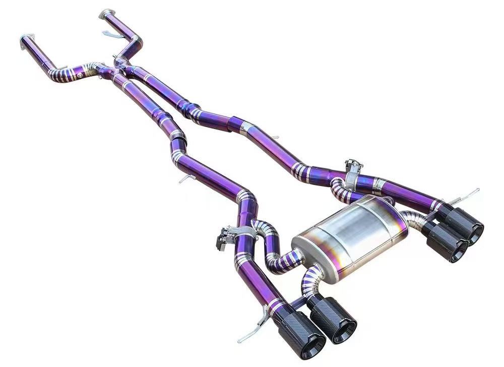 Exhaust pipe and muffler assembly with colored metal surfaces.