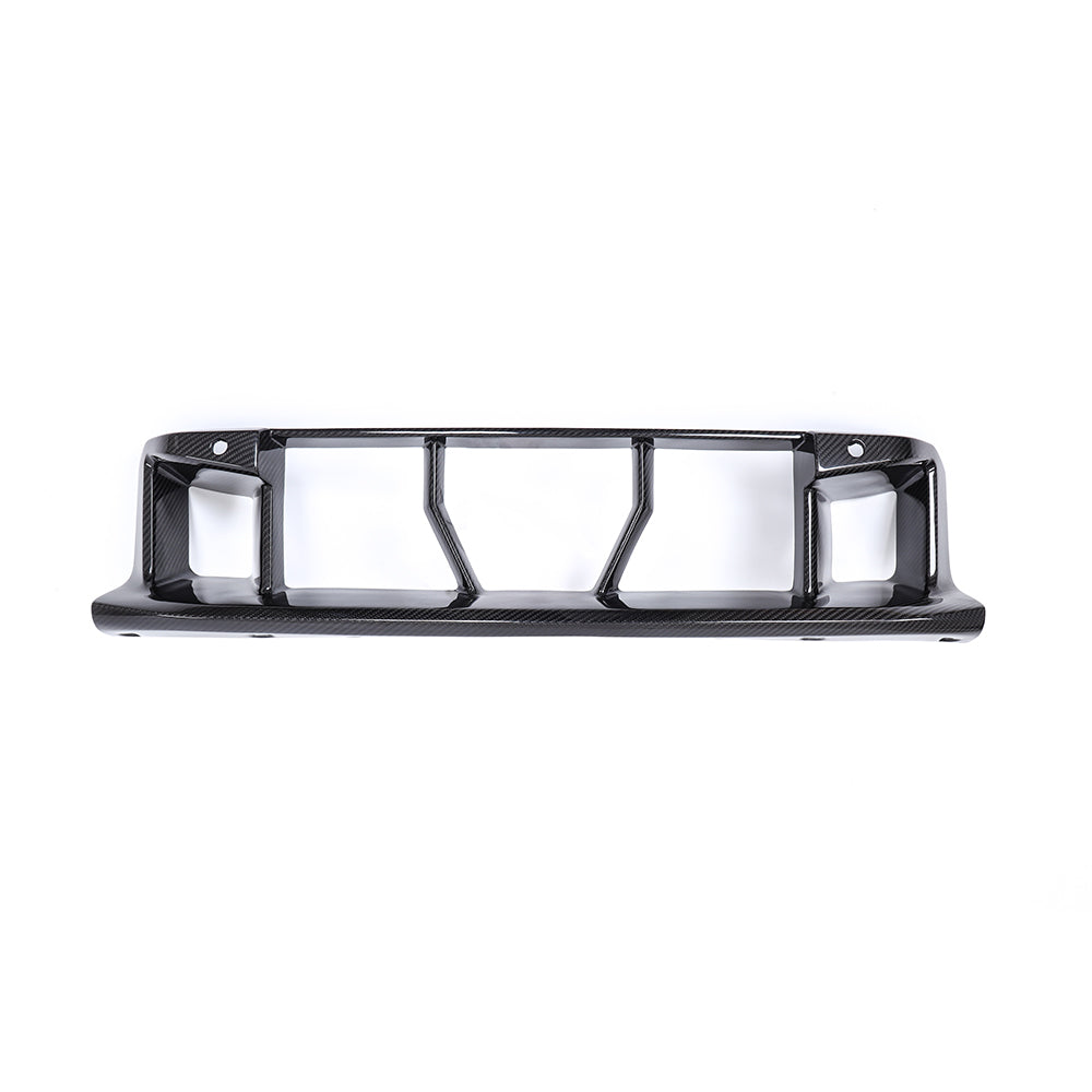 Wide rectangular lower grille with vertical dividers.