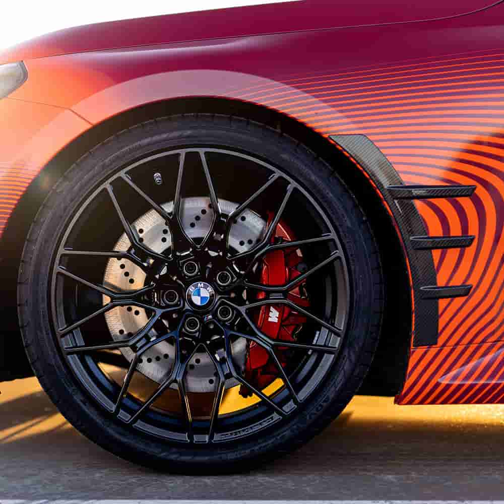 Front wheel-area reference on a red vehicle.
