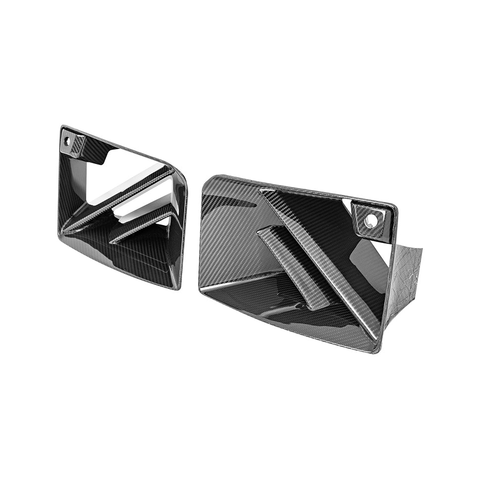 Pair of rectangular bumper vent pieces with diagonal bars.