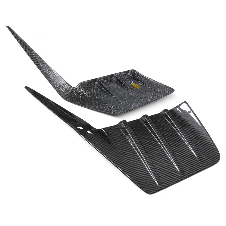 Pair of shaped rear trim pieces with raised fins.