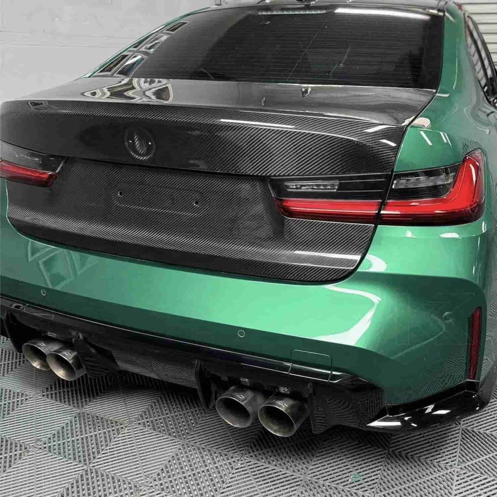 Rear-quarter vehicle reference showing a dark trunk lid.