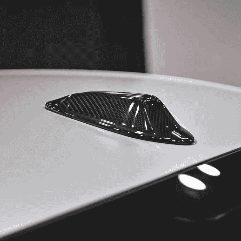 Shark-fin styling reference on a light vehicle roof.