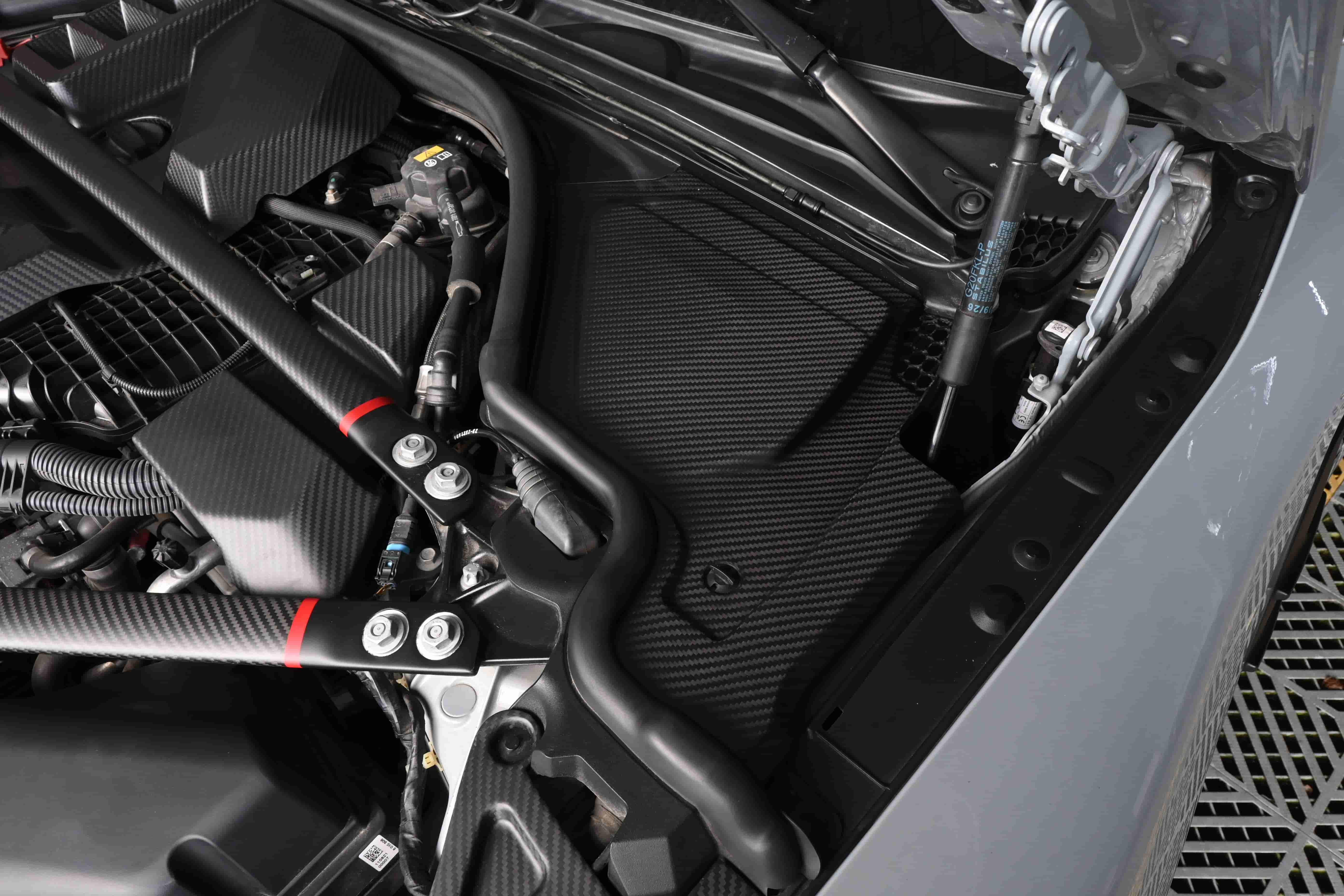 Engine-bay side-panel installation reference.