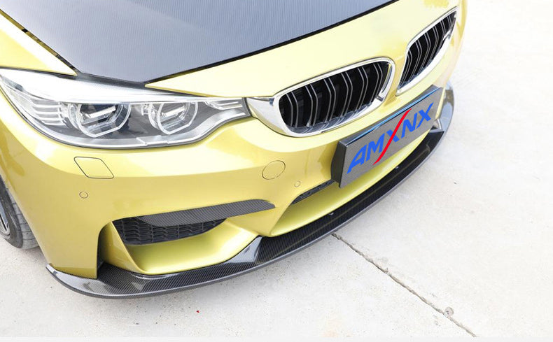Front bumper reference on a yellow BMW.