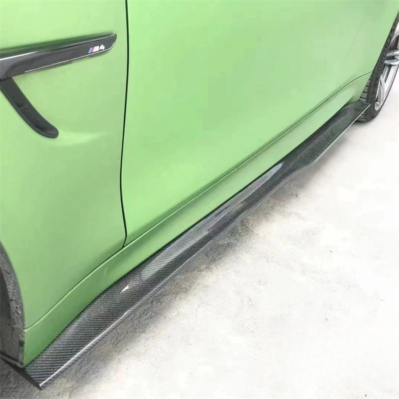 Side sill reference on a green vehicle.