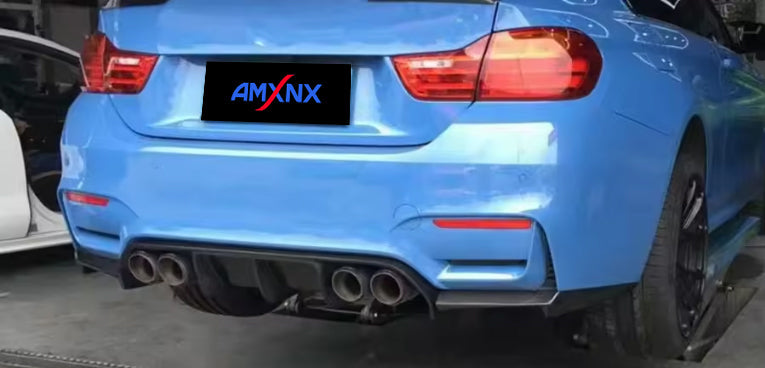 Rear-quarter view of a blue BMW with diffuser styling.