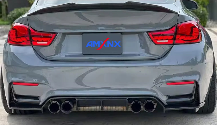 Rear view of a gray BMW with a diffuser.