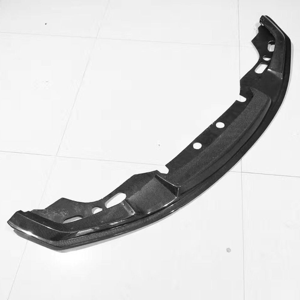 Underside view of a curved front lip with visible openings.