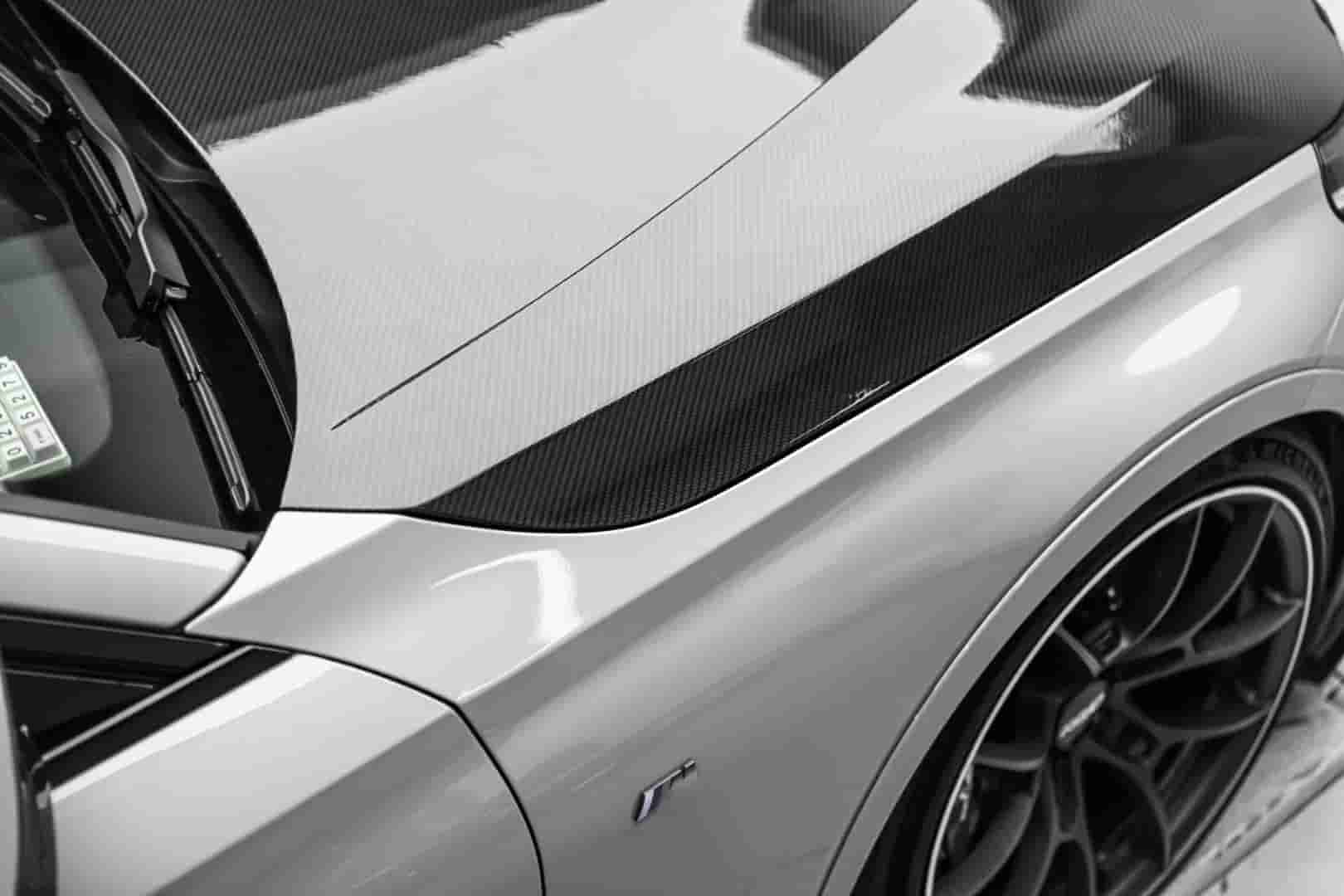 Angled vehicle view showing the hood profile.