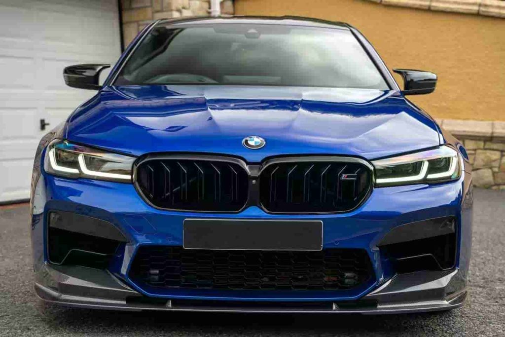 Front view of a blue BMW with lower bumper styling.