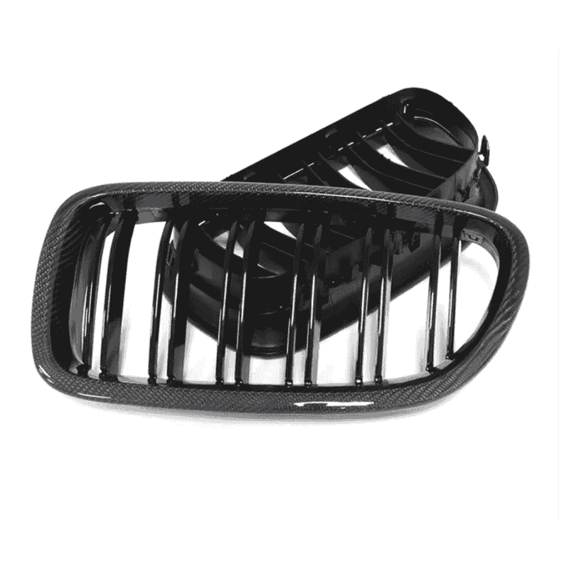 Angled view of paired kidney grille pieces with vertical bars.