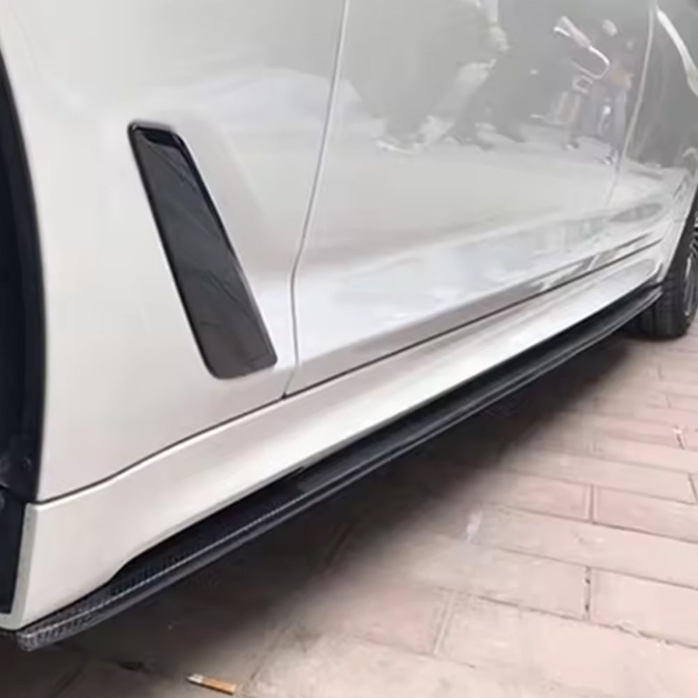 Side sill reference on a white vehicle.