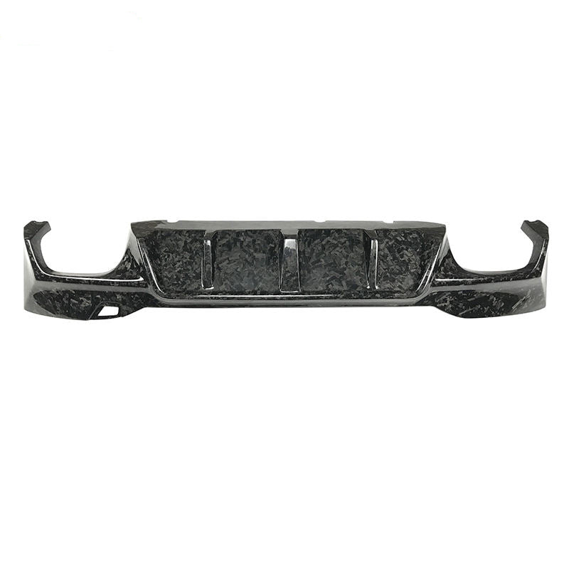 Rear diffuser with center fins and an irregular patterned surface.