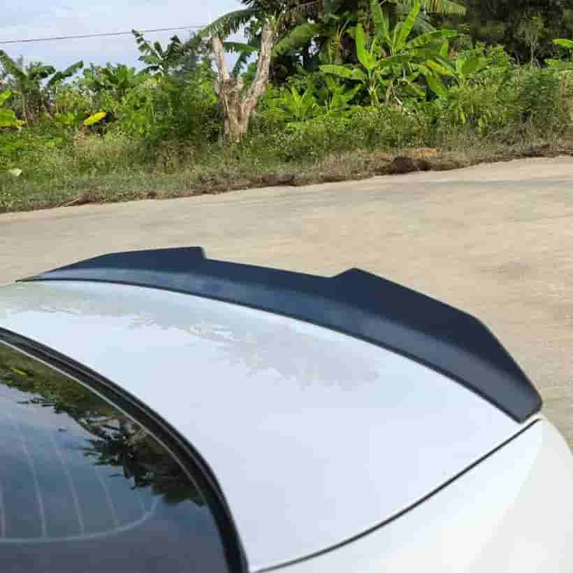 Close vehicle-trunk reference showing a rear spoiler.