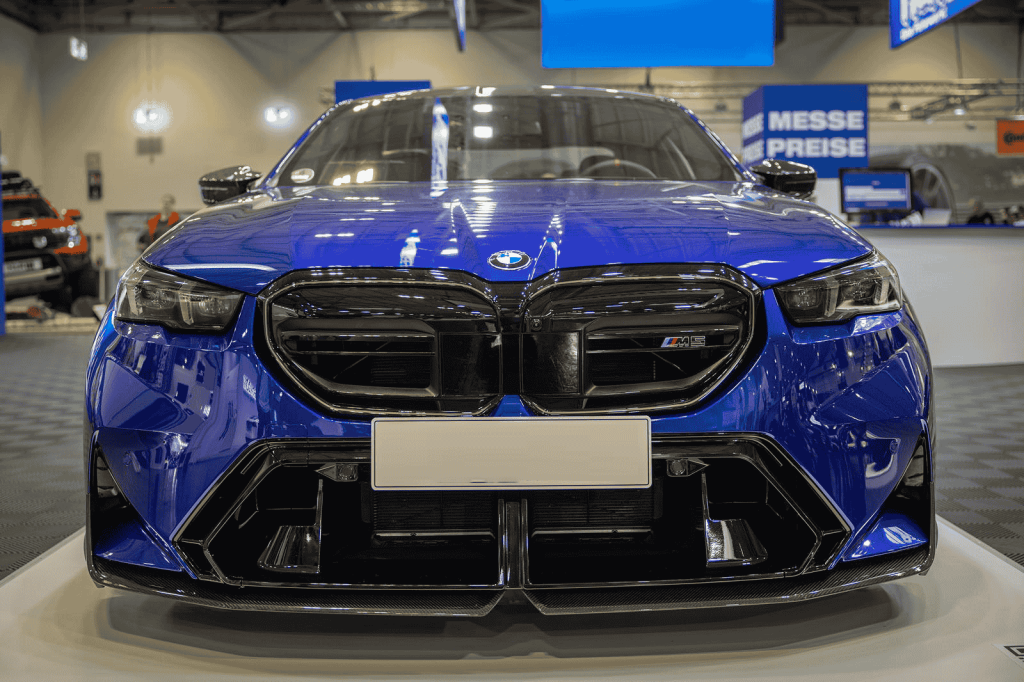 Front view of a blue BMW with lower grille styling.
