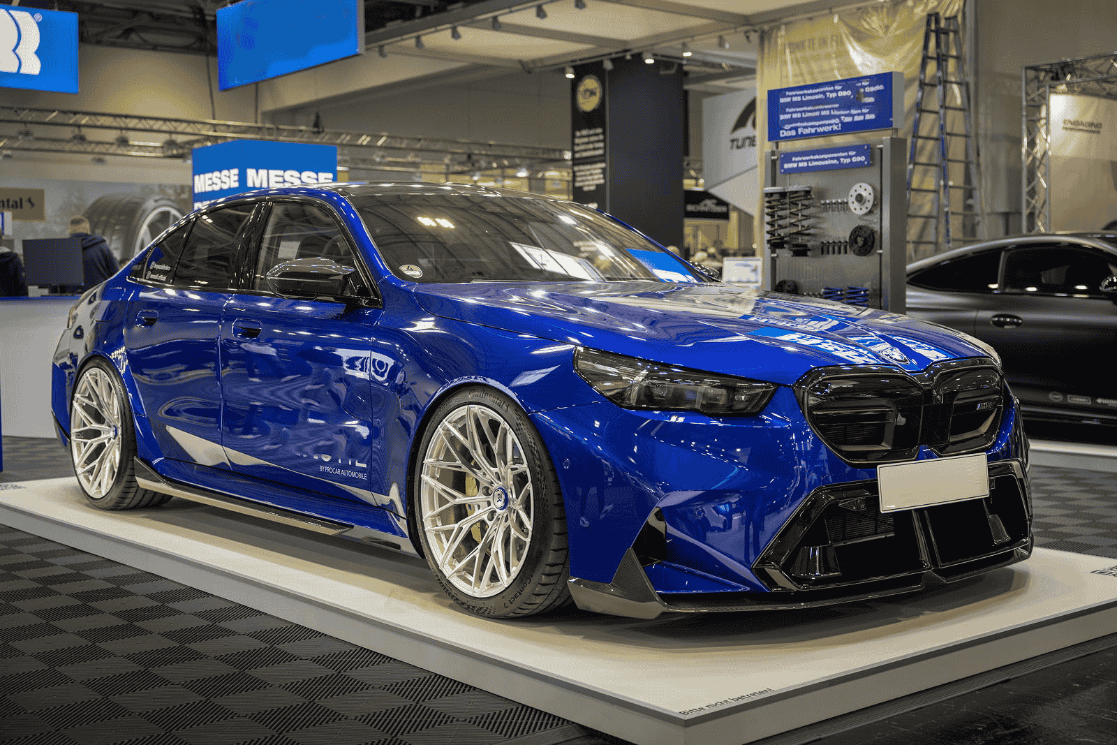 Front-quarter view of a blue BMW display car.