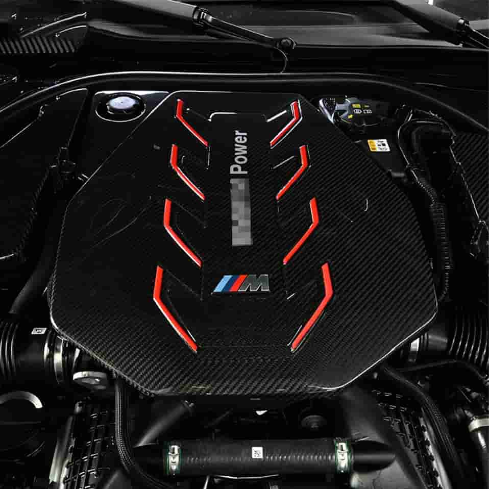 Engine-bay view of a cover with red graphics.