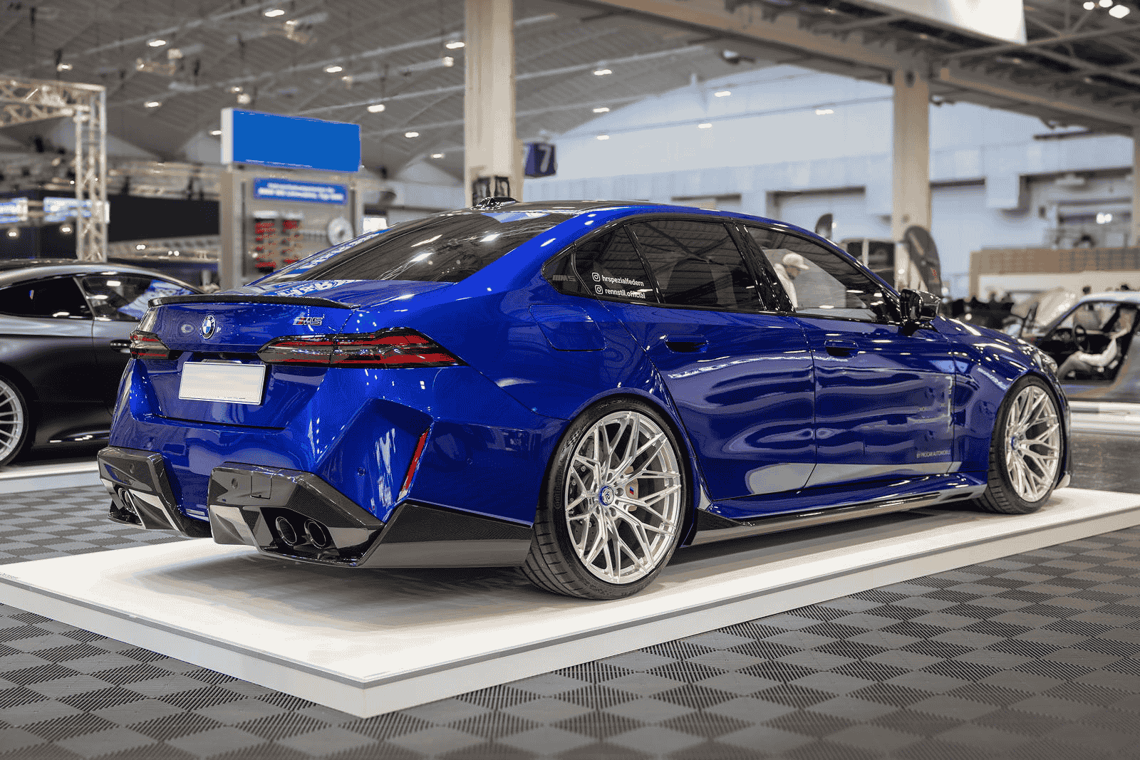 Rear-quarter styling view of a blue BMW.