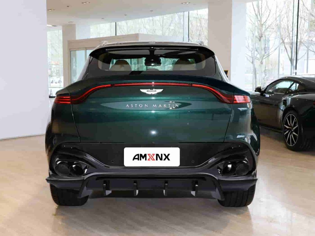 Rear view of a dark green SUV with exterior styling.