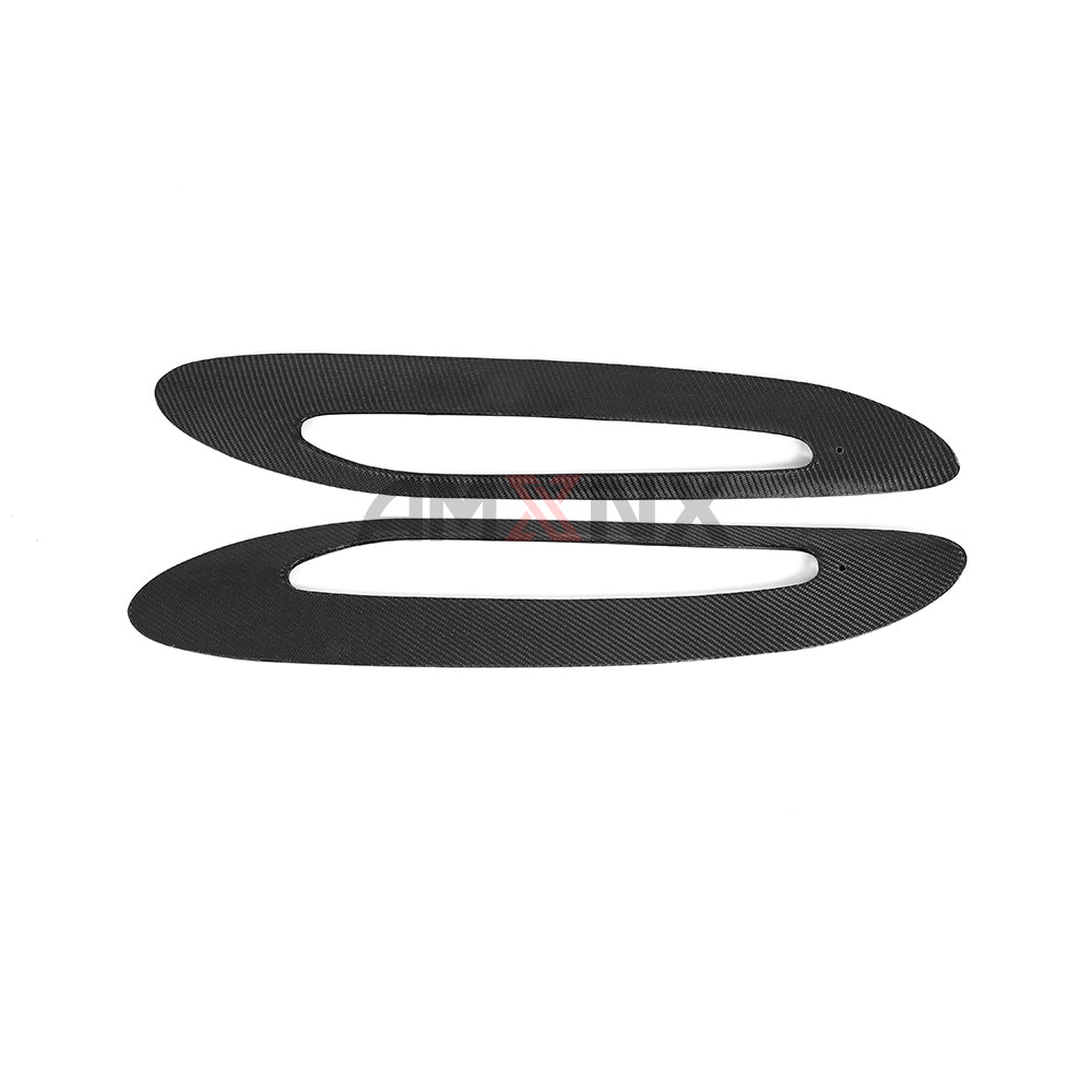 Opposite view of two oval trim surrounds.