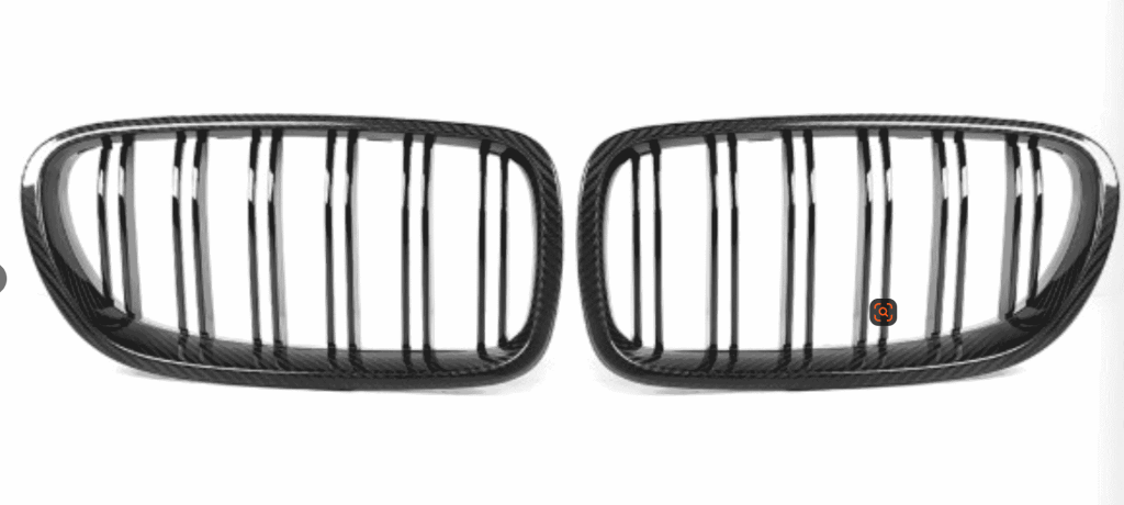 Two kidney grille pieces with vertical bars.