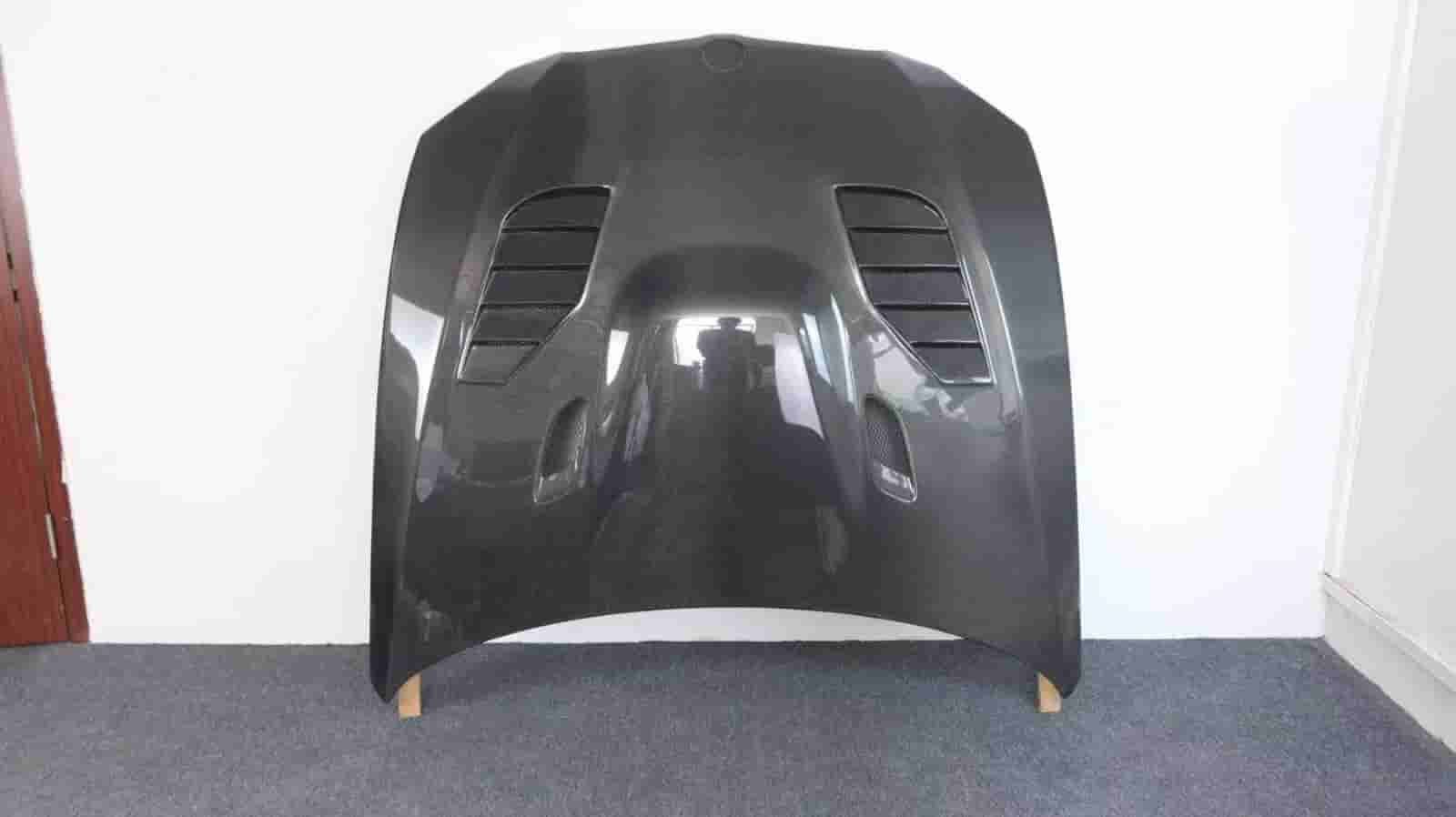 Vented hood panel standing against a wall.