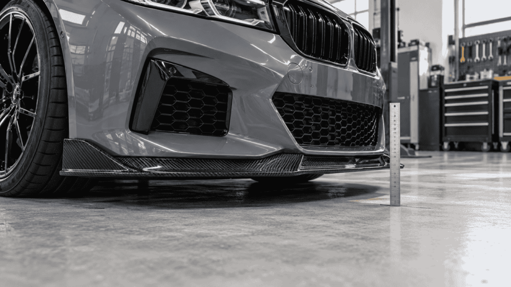 Illustration: Front lip on a lowered-car concept with a ruler beside the front edge.