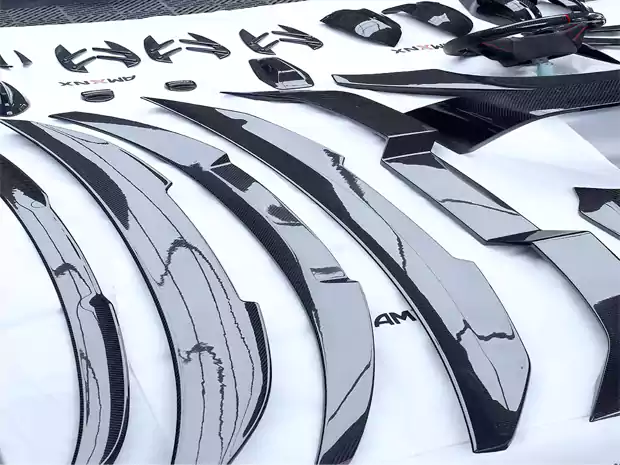 Finished dry carbon fiber automotive parts after production at CCF