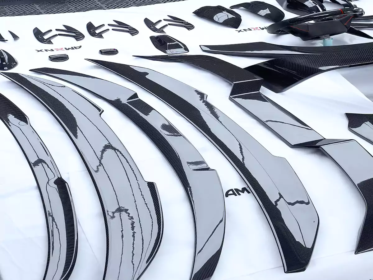 Finished dry carbon fiber automotive parts after production at CCF